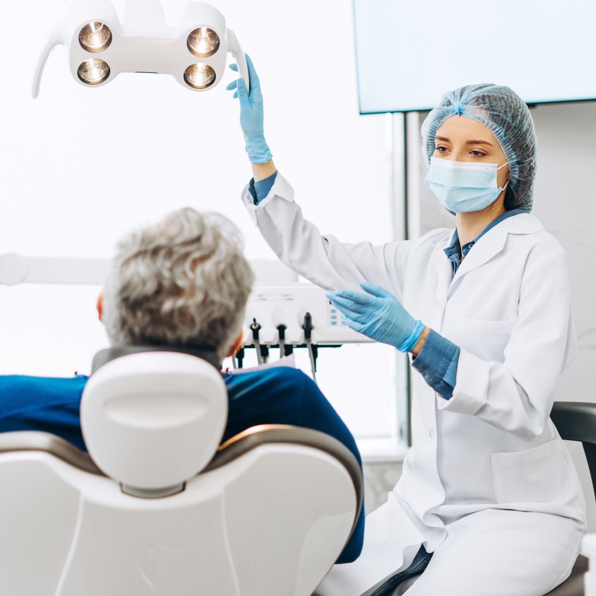 A dentist talking to her patient